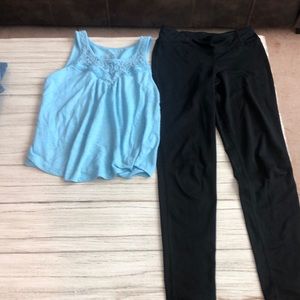 black champion leggings and blue tank top